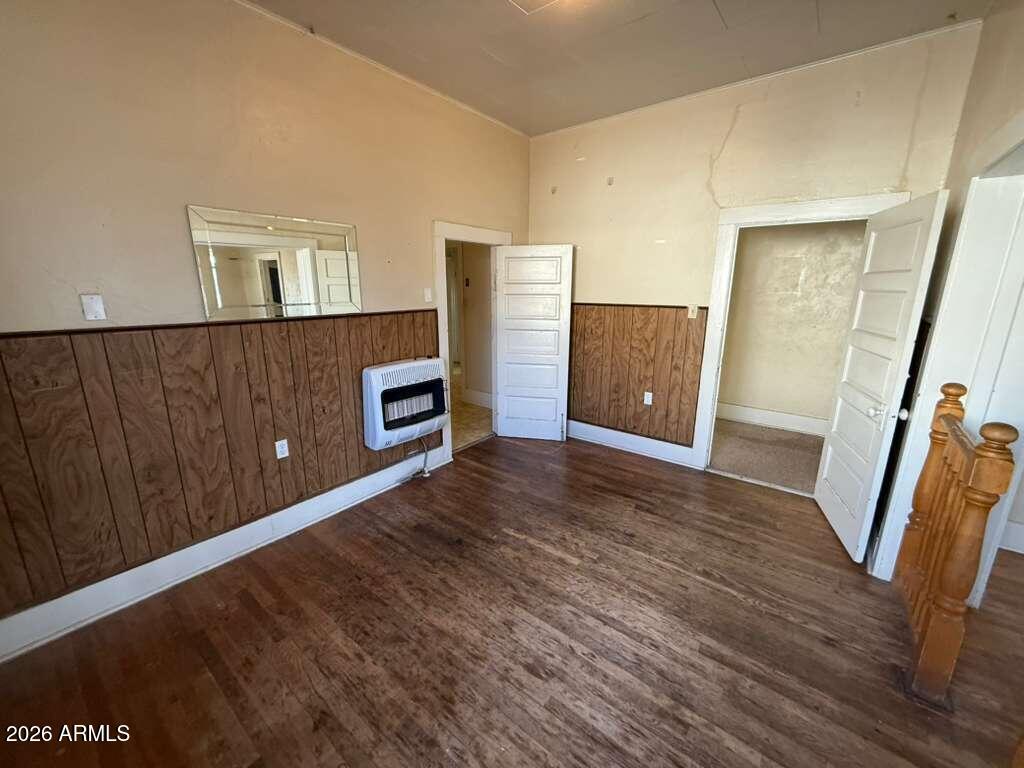 1014 East 14th Street Douglas, AZ 85607 - Photo 11 of 38 a view of an empty room with wooden floor and a window