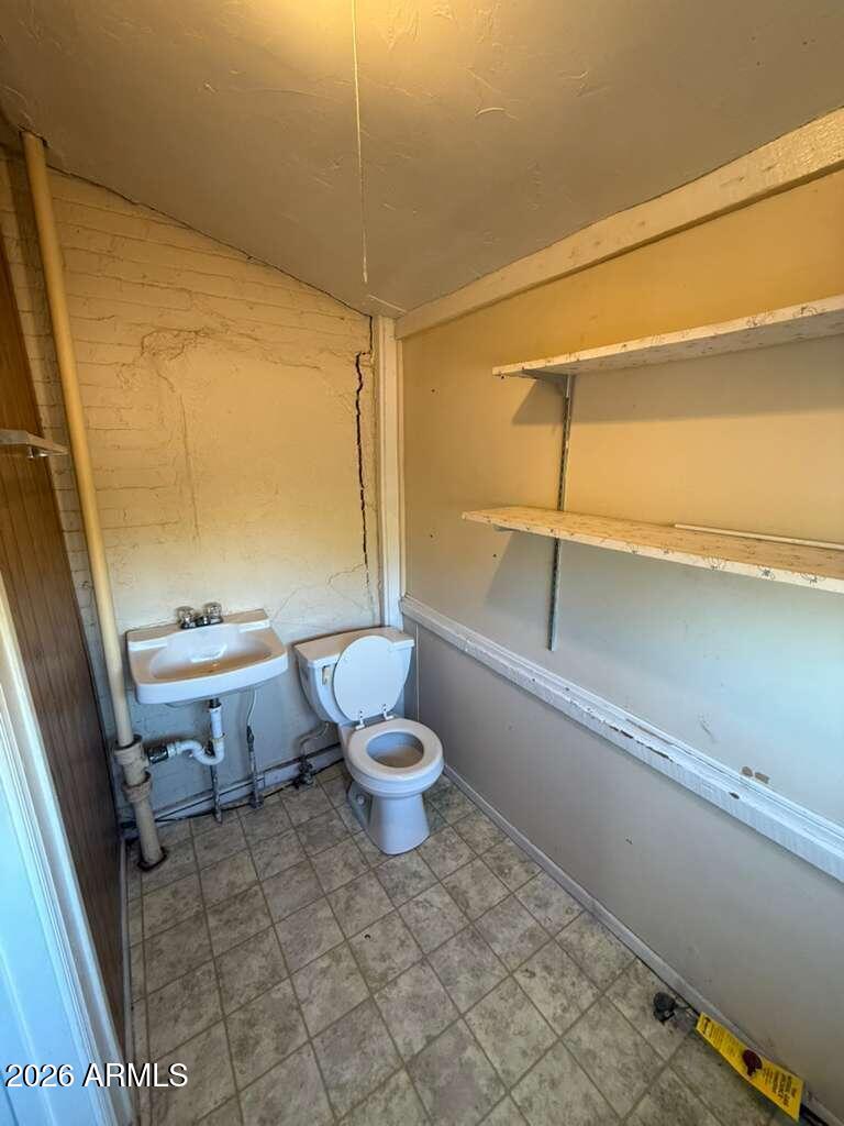 1014 East 14th Street Douglas, AZ 85607 - Photo 30 of 38 a bathroom with a toilet sink and shower