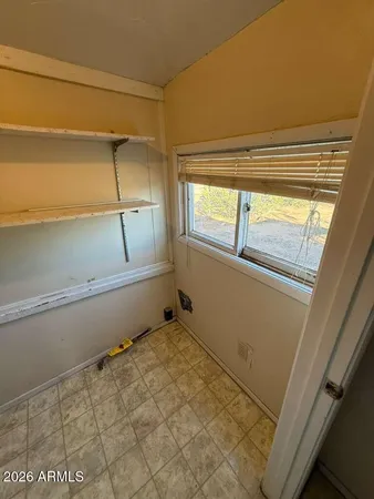 a view of an empty room and window