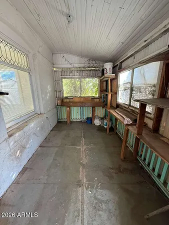 a view of a livingroom with furniture and windows