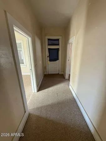 a view of a room with a hallway