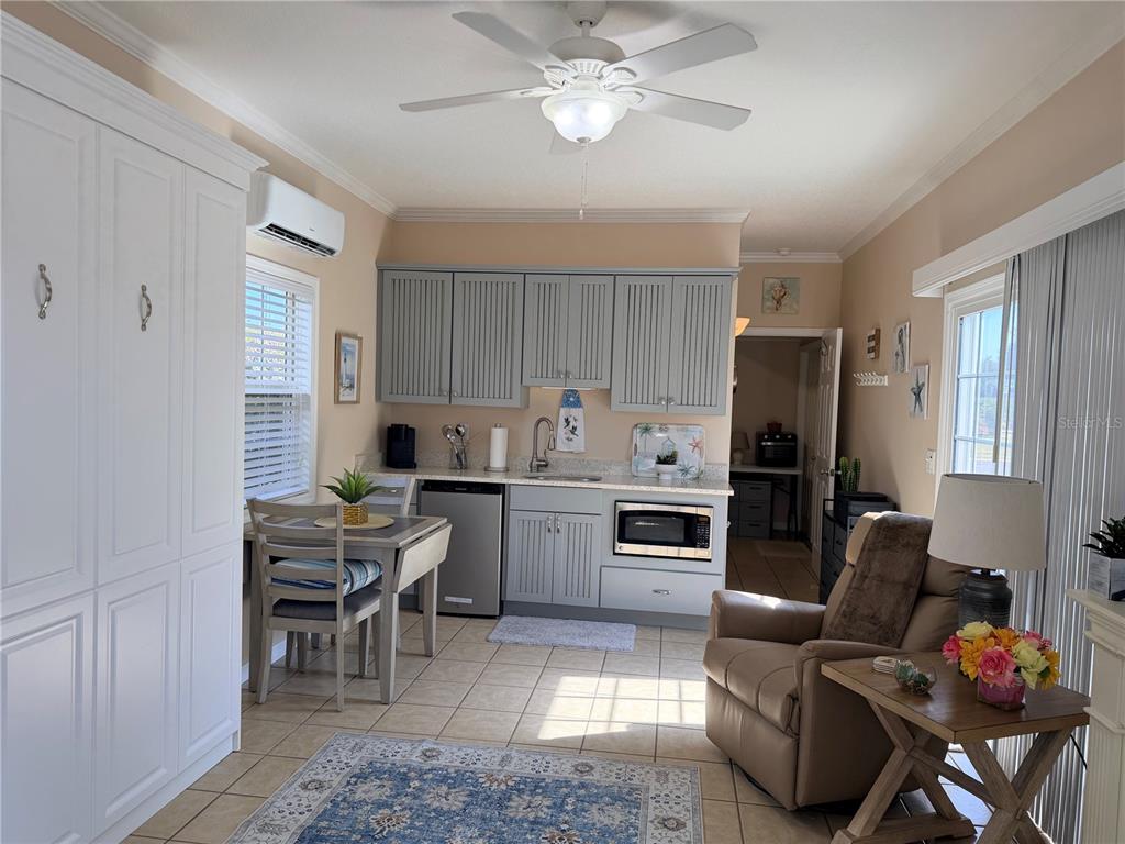 9486 Southeast 47th Way Webster, FL 33597 - Photo 11 of 32 a kitchen with refrigerator cabinets and furniture