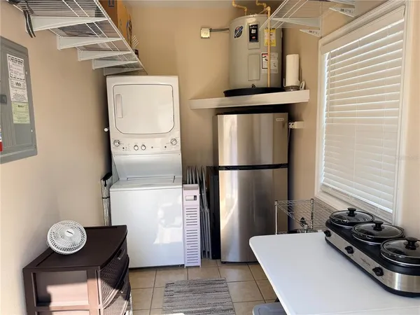 a kitchen with a refrigerator and a stove