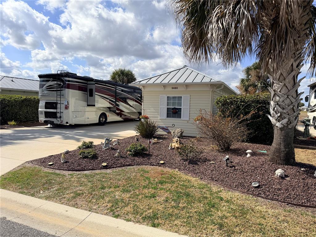 9486 Southeast 47th Way Webster, FL 33597 - Photo 2 of 32 a view of a house with a yard