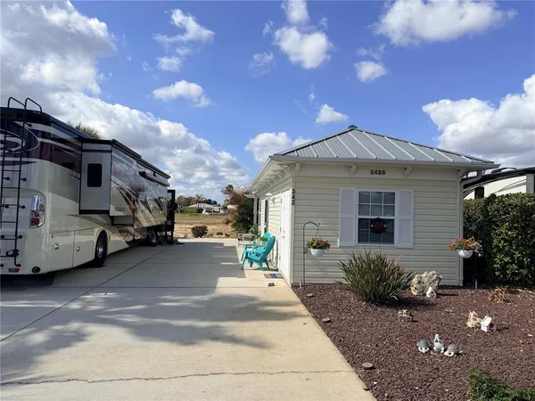 a view of a car park in front of house