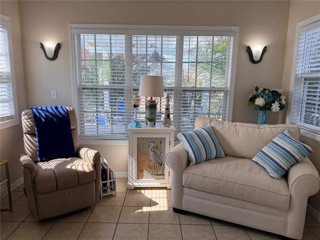 9486 Southeast 47th Way Webster, FL 33597 - Photo 9 of 32 a living room with furniture and a window