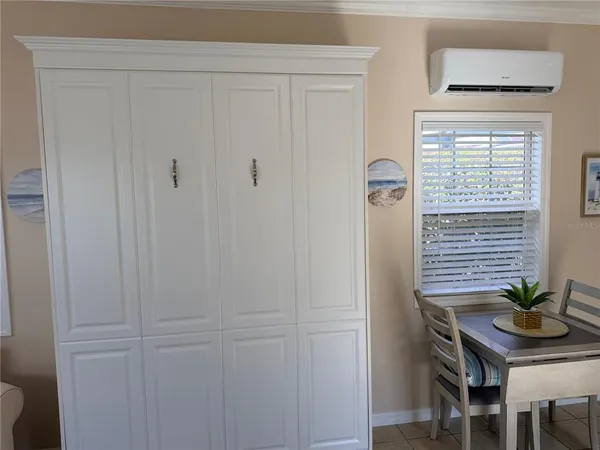 a view of a workspace room with a window