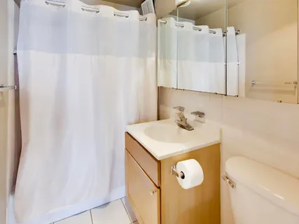 a bathroom with a sink vanity and a mirror