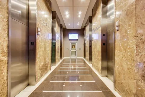 a patio with a table and chairs under an umbrella