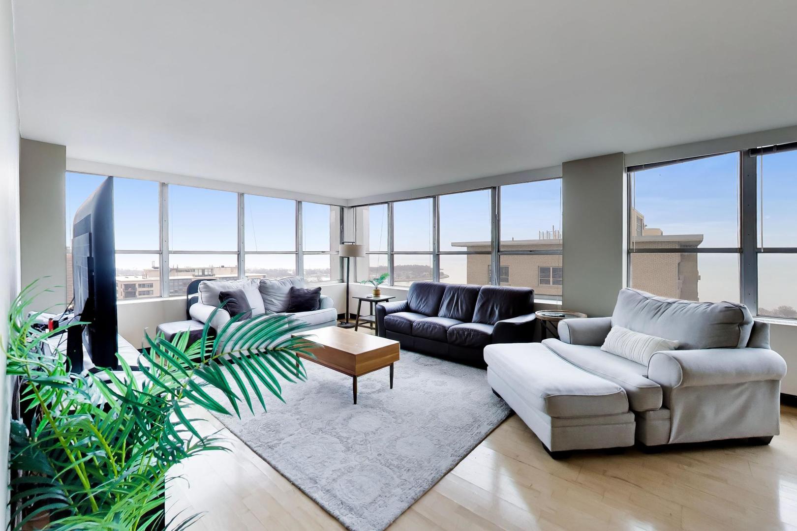 655 West Irving Park Road, Unit 2302 Chicago, IL 60613 - Photo 4 of 41 a living room with furniture and a window