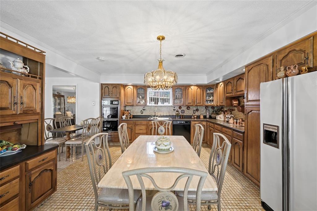 213 18th Street Pittsburgh, PA 15215 - Photo 15 of 42 a view of a dining room with furniture window and wooden floor