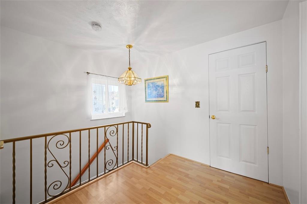 213 18th Street Pittsburgh, PA 15215 - Photo 16 of 42 a view of a hallway with windows