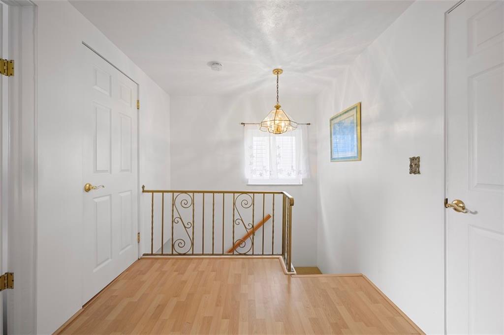 213 18th Street Pittsburgh, PA 15215 - Photo 17 of 42 a view of hallway with wooden floor