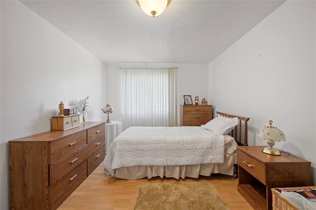 213 18th Street Pittsburgh, PA 15215 - Photo 22 of 42 a bedroom with a bed and a dresser