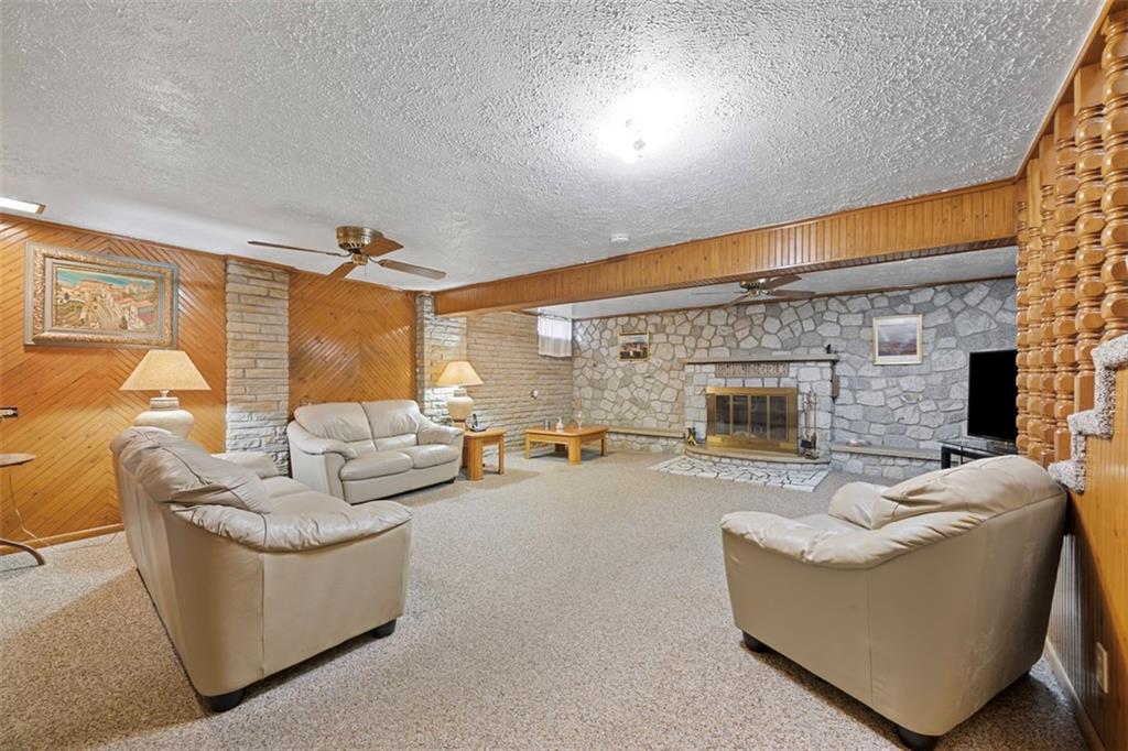 213 18th Street Pittsburgh, PA 15215 - Photo 27 of 42 a living room with furniture and a fireplace