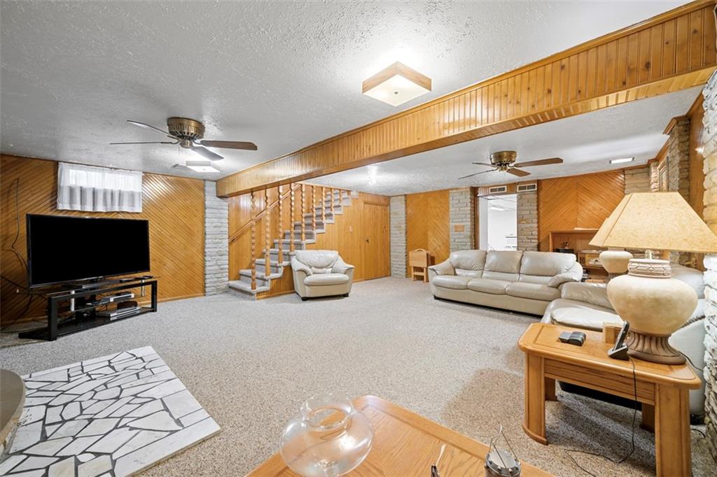 213 18th Street Pittsburgh, PA 15215 - Photo 28 of 42 a living room with furniture a flat screen tv and a window