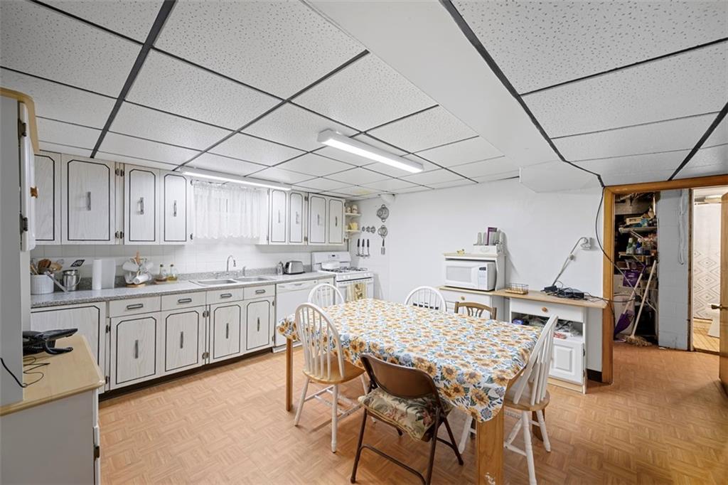 213 18th Street Pittsburgh, PA 15215 - Photo 30 of 42 a view of kitchen with cabinets and wooden floor