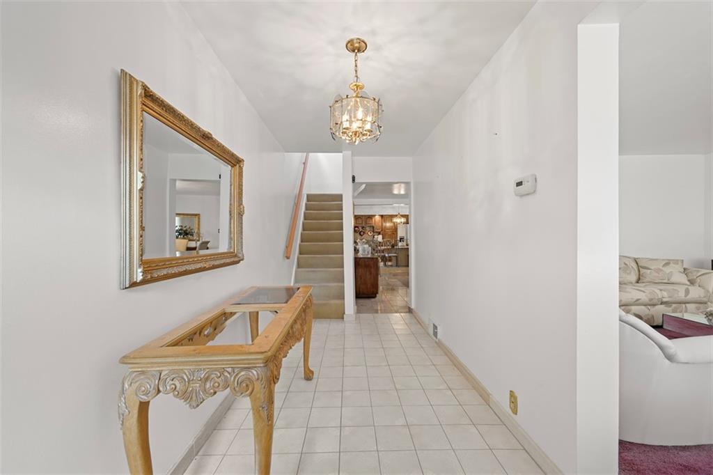 213 18th Street Pittsburgh, PA 15215 - Photo 3 of 42 a view of a hallway with washer and dryer