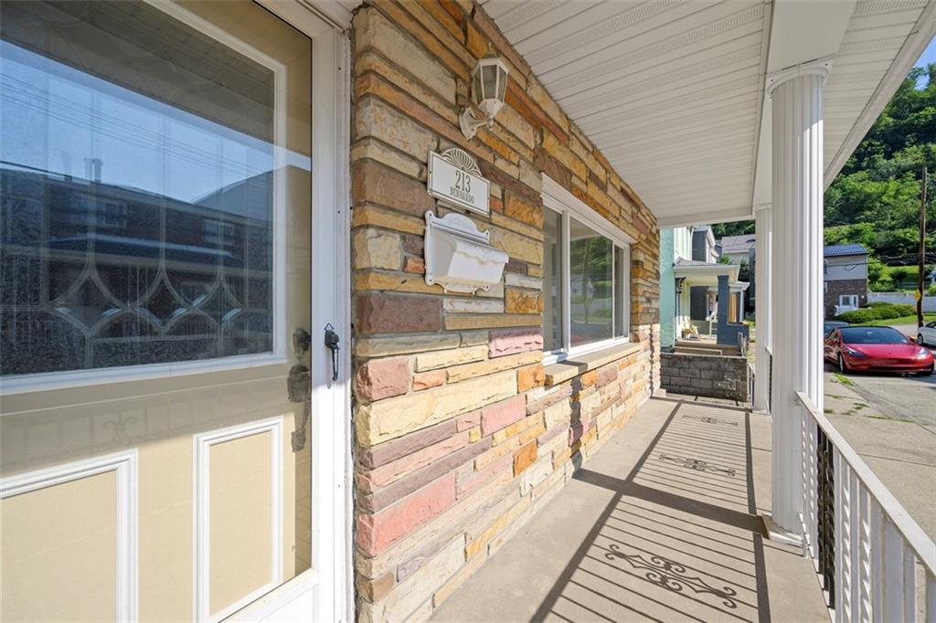 213 18th Street Pittsburgh, PA 15215 - Photo 32 of 42 a view of a balcony with wooden floor and a floor to ceiling window