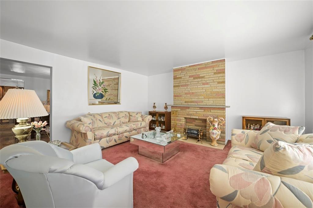 213 18th Street Pittsburgh, PA 15215 - Photo 5 of 42 a living room with furniture fireplace and a large window
