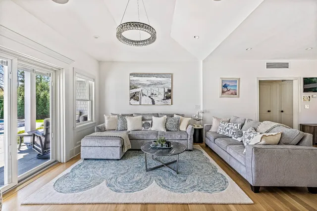 a living room with furniture and a rug