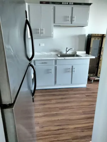 a view of a sink with washer and dryer