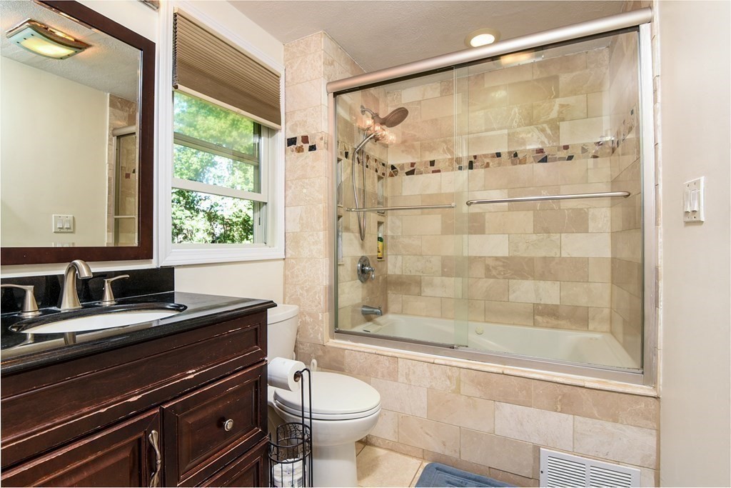 101 Standish Road Needham, MA 02492 - Photo 17 of 38 a bathroom with a sink a toilet and shower
