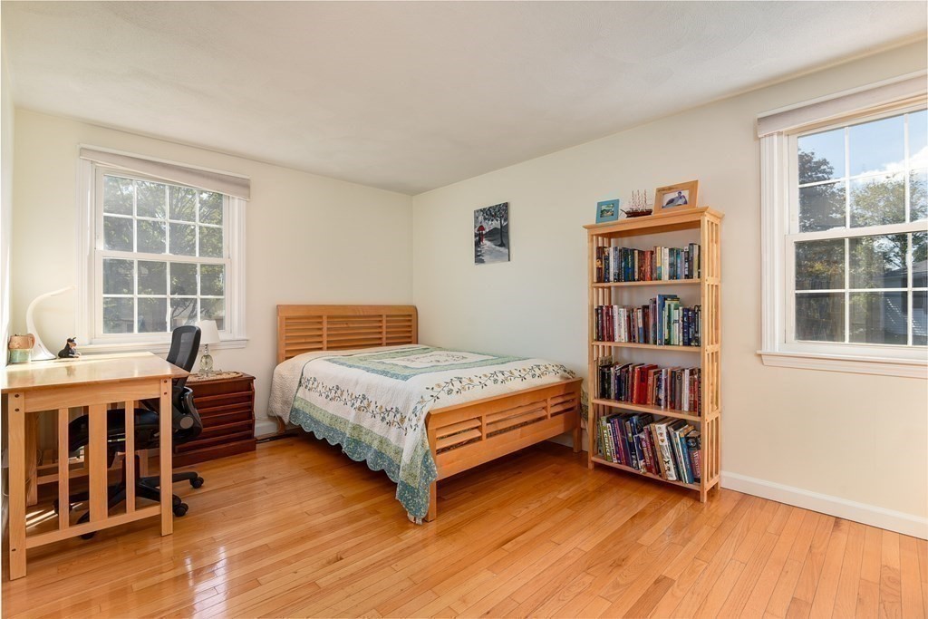 101 Standish Road Needham, MA 02492 - Photo 18 of 38 a bedroom with a bed and a book shelf
