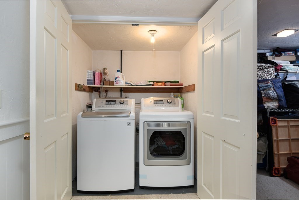 101 Standish Road Needham, MA 02492 - Photo 25 of 38 a utility room with dryer and washer