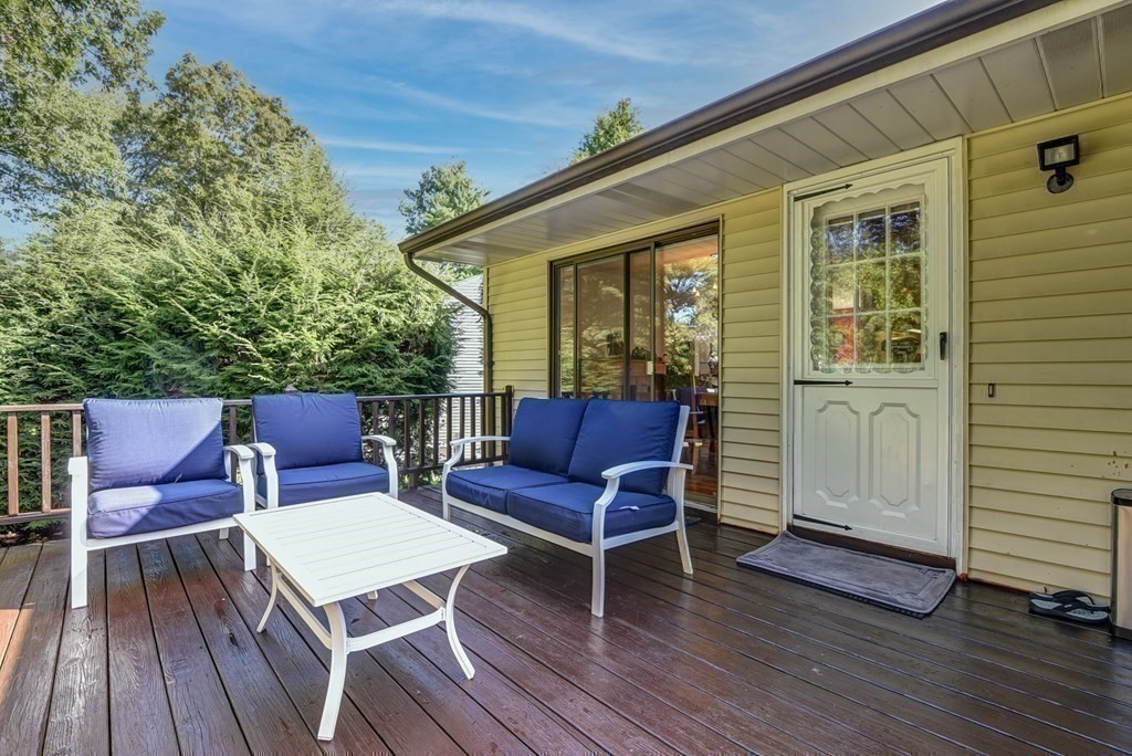 101 Standish Road Needham, MA 02492 - Photo 26 of 38 a balcony with wooden floor table and chairs