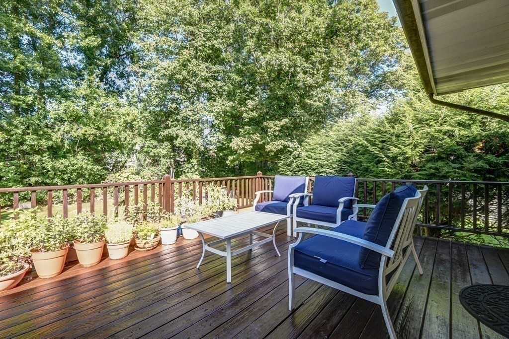 101 Standish Road Needham, MA 02492 - Photo 28 of 38 a balcony with wooden floor table and chairs