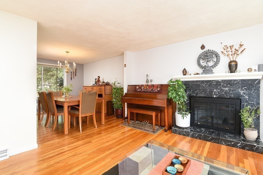 101 Standish Road Needham, MA 02492 - Photo 5 of 38 a living room with furniture a fireplace and next to a window