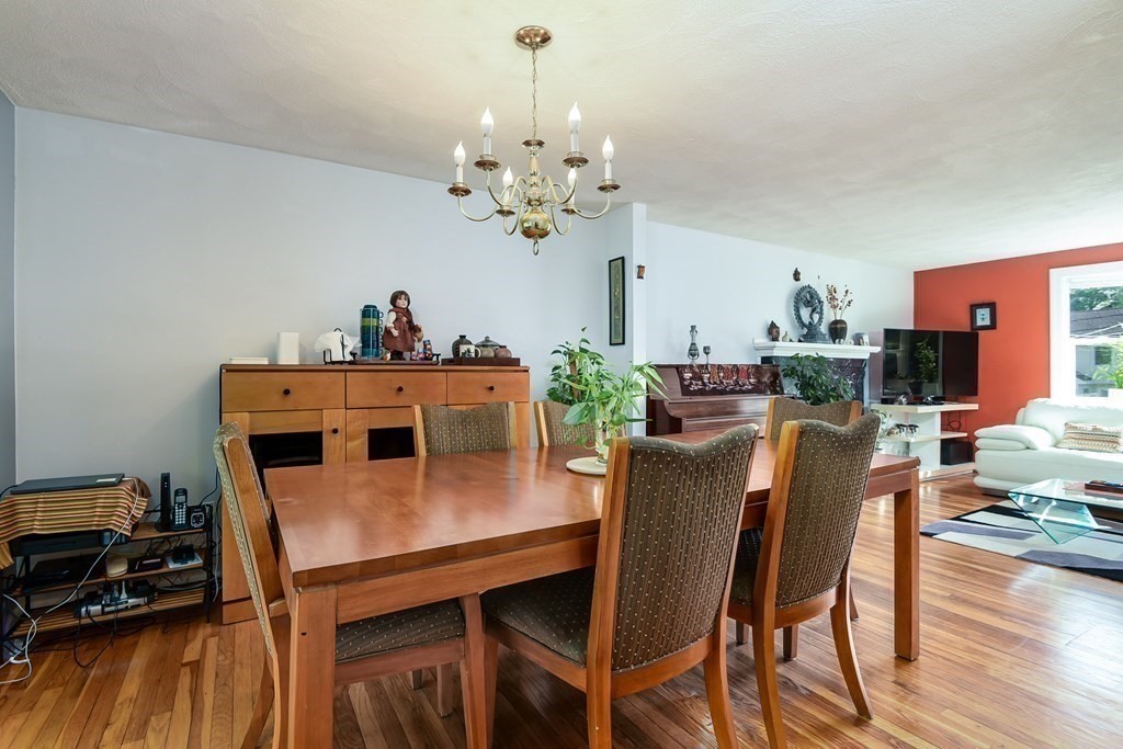 101 Standish Road Needham, MA 02492 - Photo 8 of 38 a dining room with furniture and wooden floor