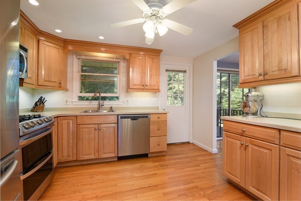 101 Standish Road Needham, MA 02492 - Photo 10 of 38 a kitchen with granite countertop a stove top oven sink and cabinets