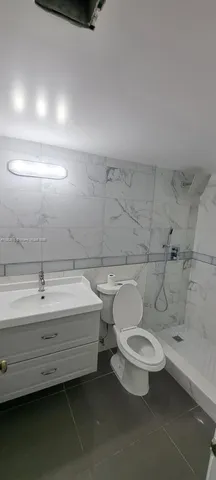 a bathroom with a sink and shower