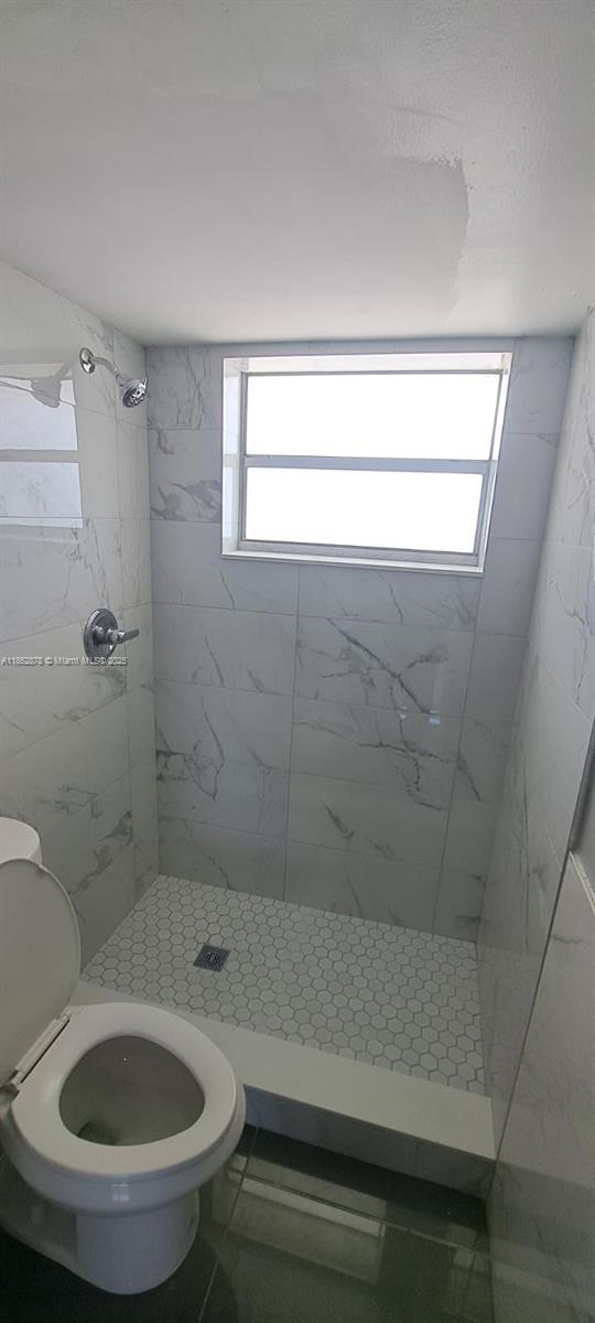 14180 Southwest 84th Street, Unit 203G Miami, FL 33183 - Photo 15 of 17 a bathroom with a sink and a toilet