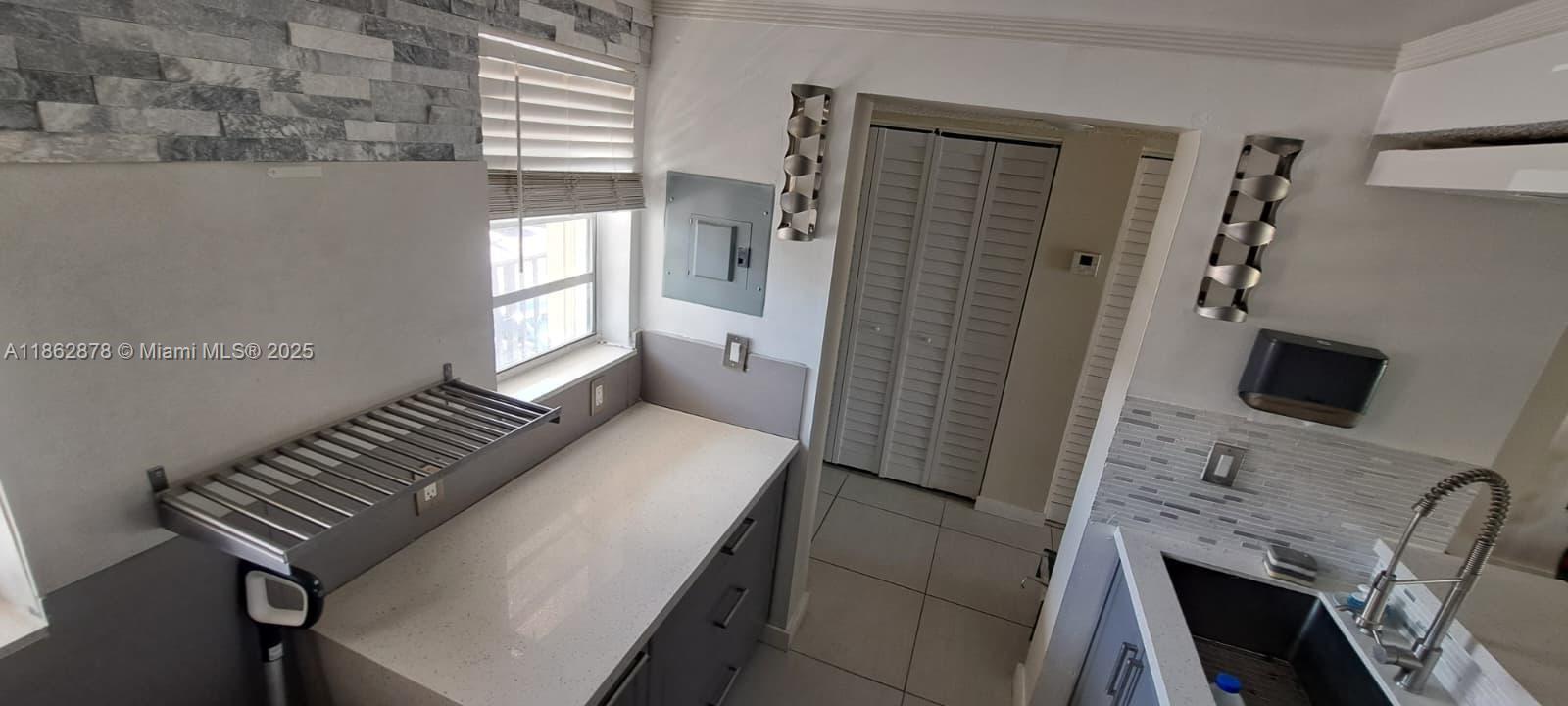 14180 Southwest 84th Street, Unit 203G Miami, FL 33183 - Photo 3 of 17 a view of a livingroom with furniture and a fireplace