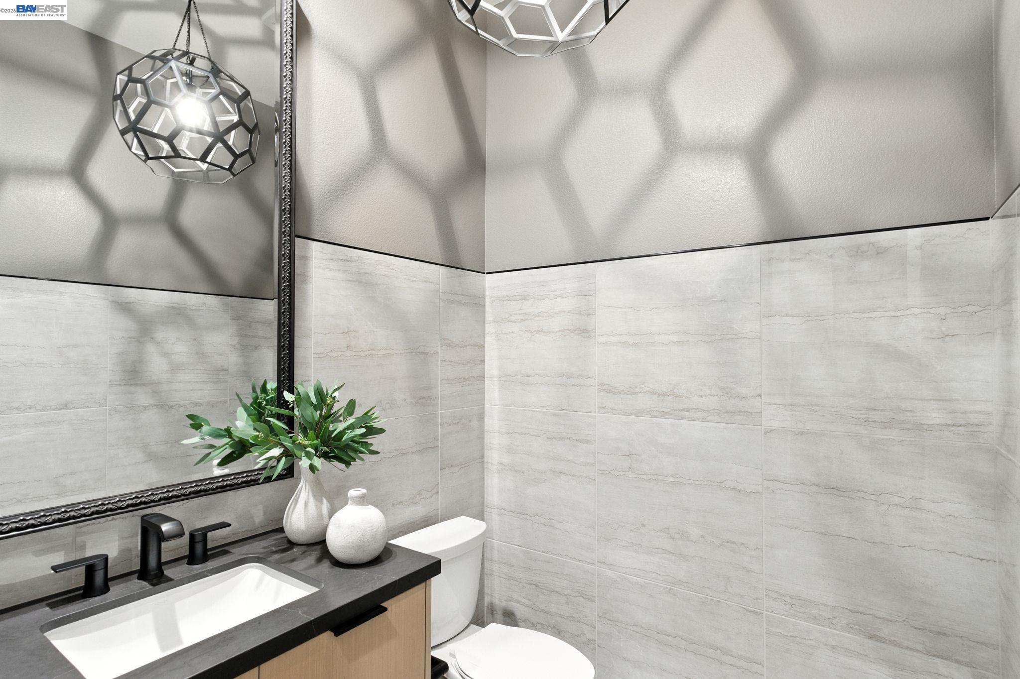 4237 Langley Road Dublin, CA 94568 - Photo 11 of 40 a bathroom with a sink toilet and mirror