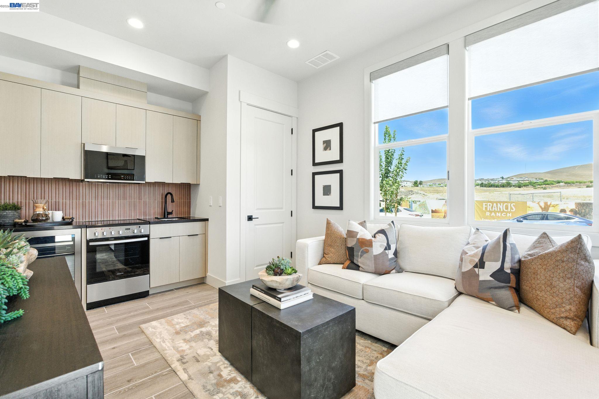 4237 Langley Road Dublin, CA 94568 - Photo 13 of 40 a living room with stainless steel appliances kitchen island granite countertop a sink and a stove top oven