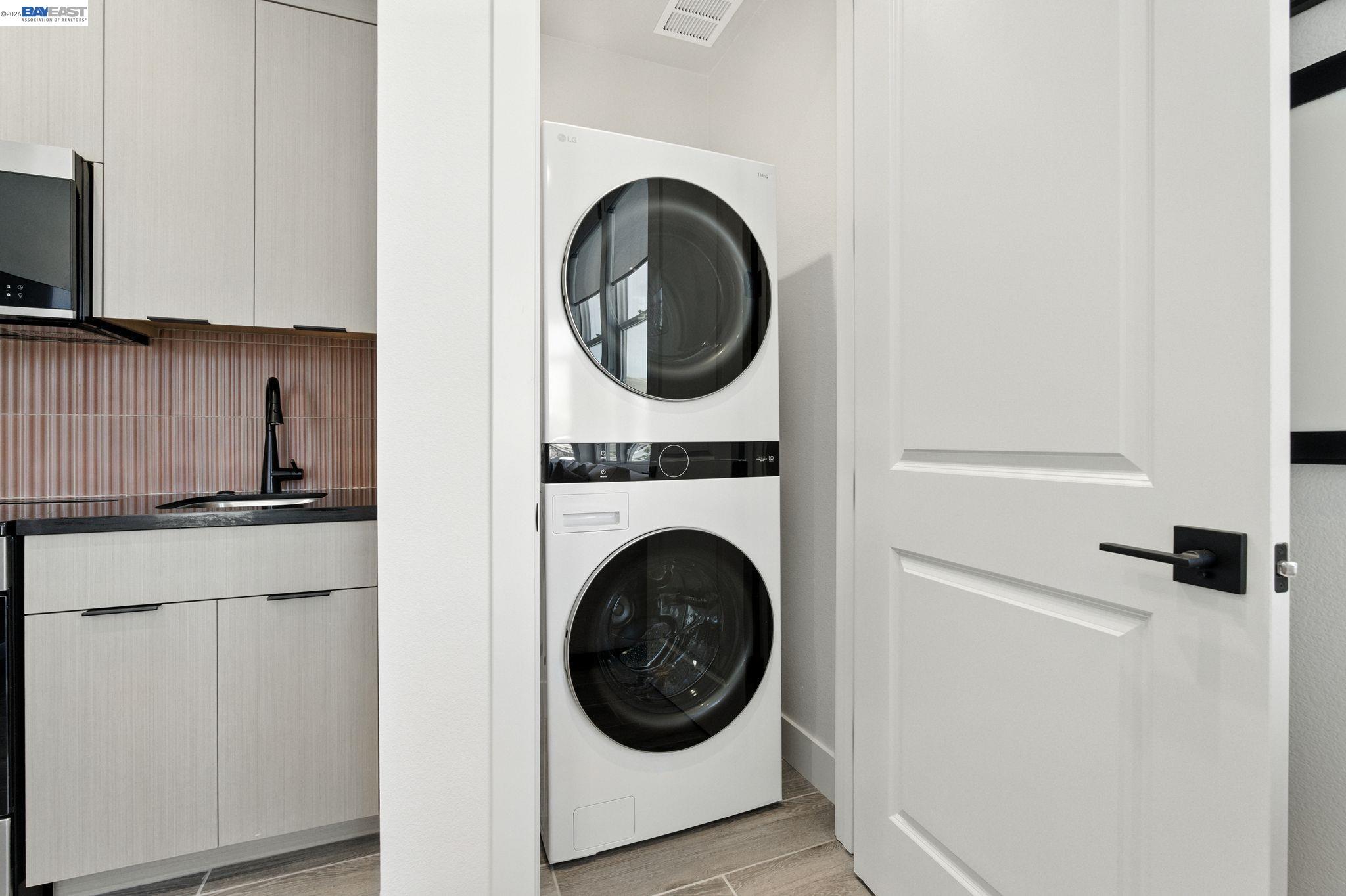 4237 Langley Road Dublin, CA 94568 - Photo 15 of 40 a close view of a utility room with dryer and washer