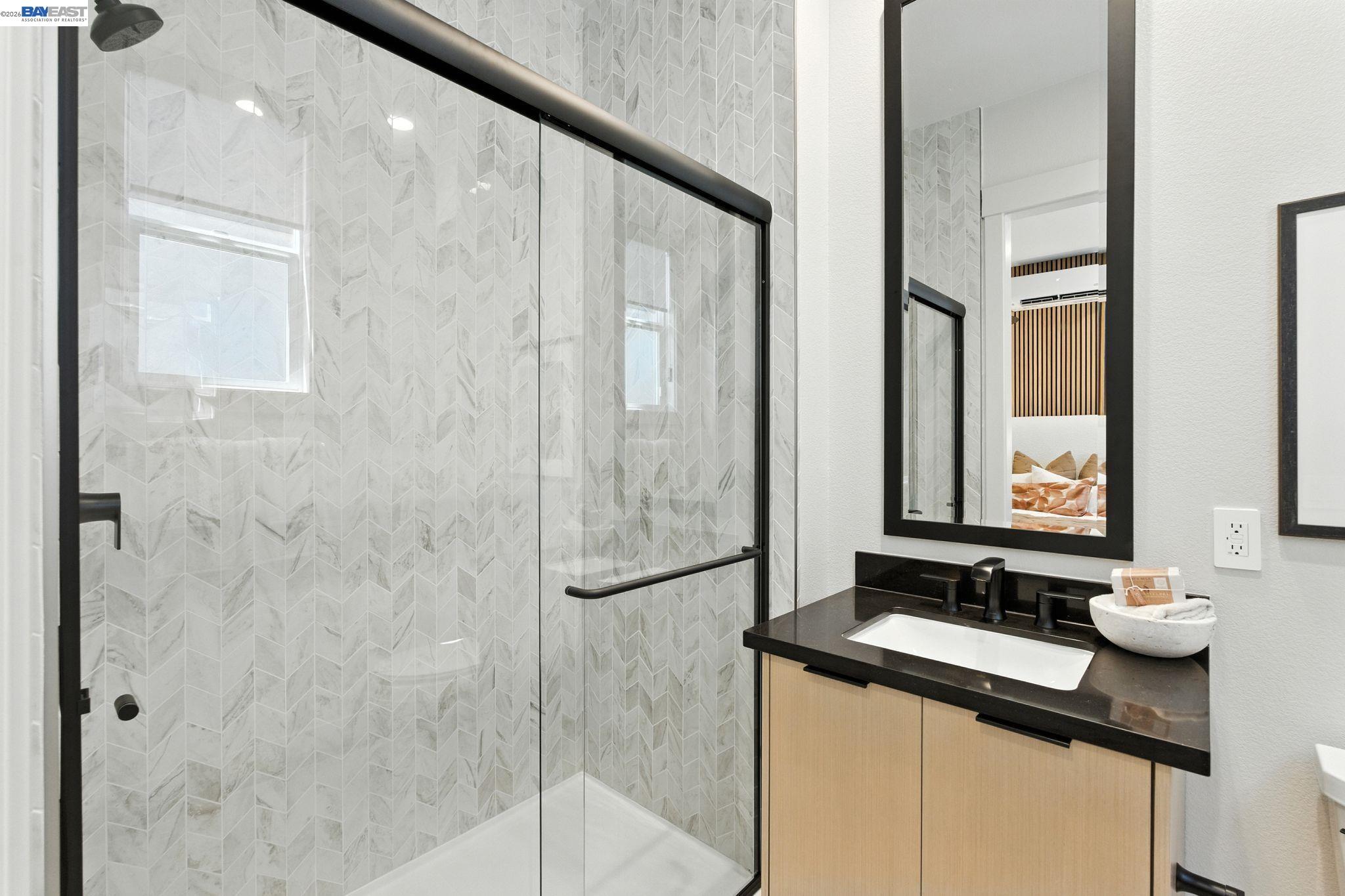 4237 Langley Road Dublin, CA 94568 - Photo 17 of 40 a bathroom with a sink and a mirror