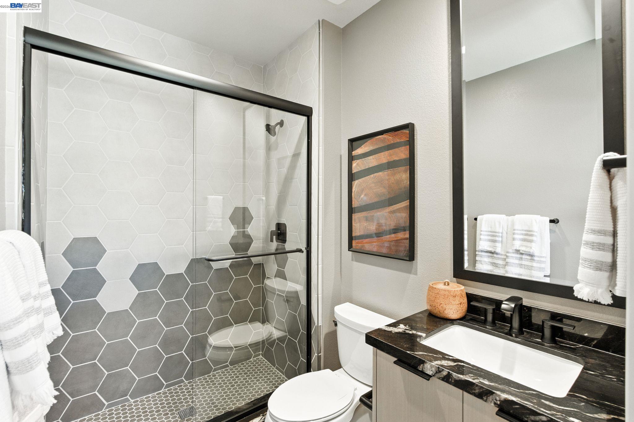 4237 Langley Road Dublin, CA 94568 - Photo 22 of 40 a bathroom with a sink toilet and shower
