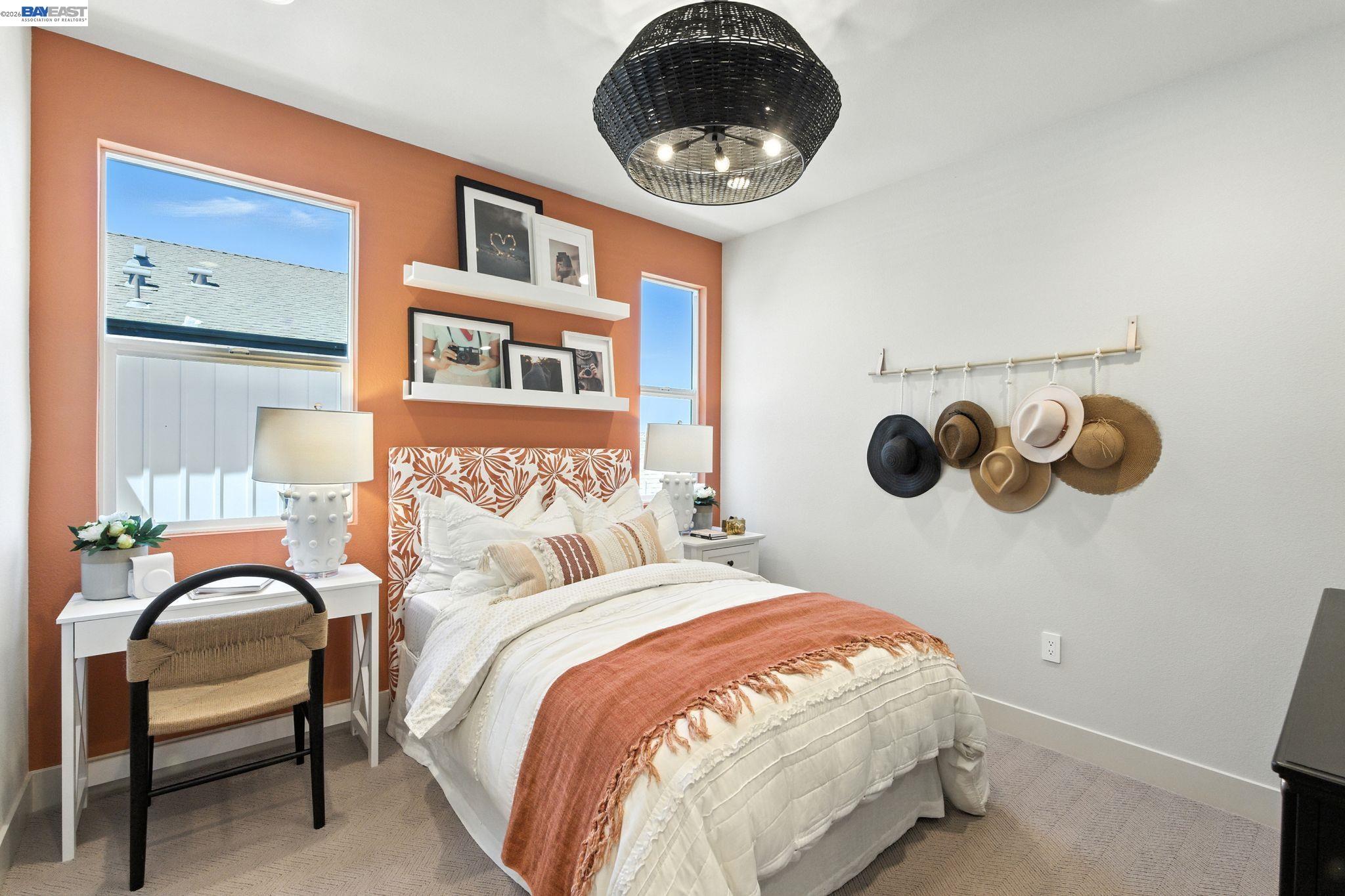 4237 Langley Road Dublin, CA 94568 - Photo 27 of 40 a bedroom with a bed and a chandelier