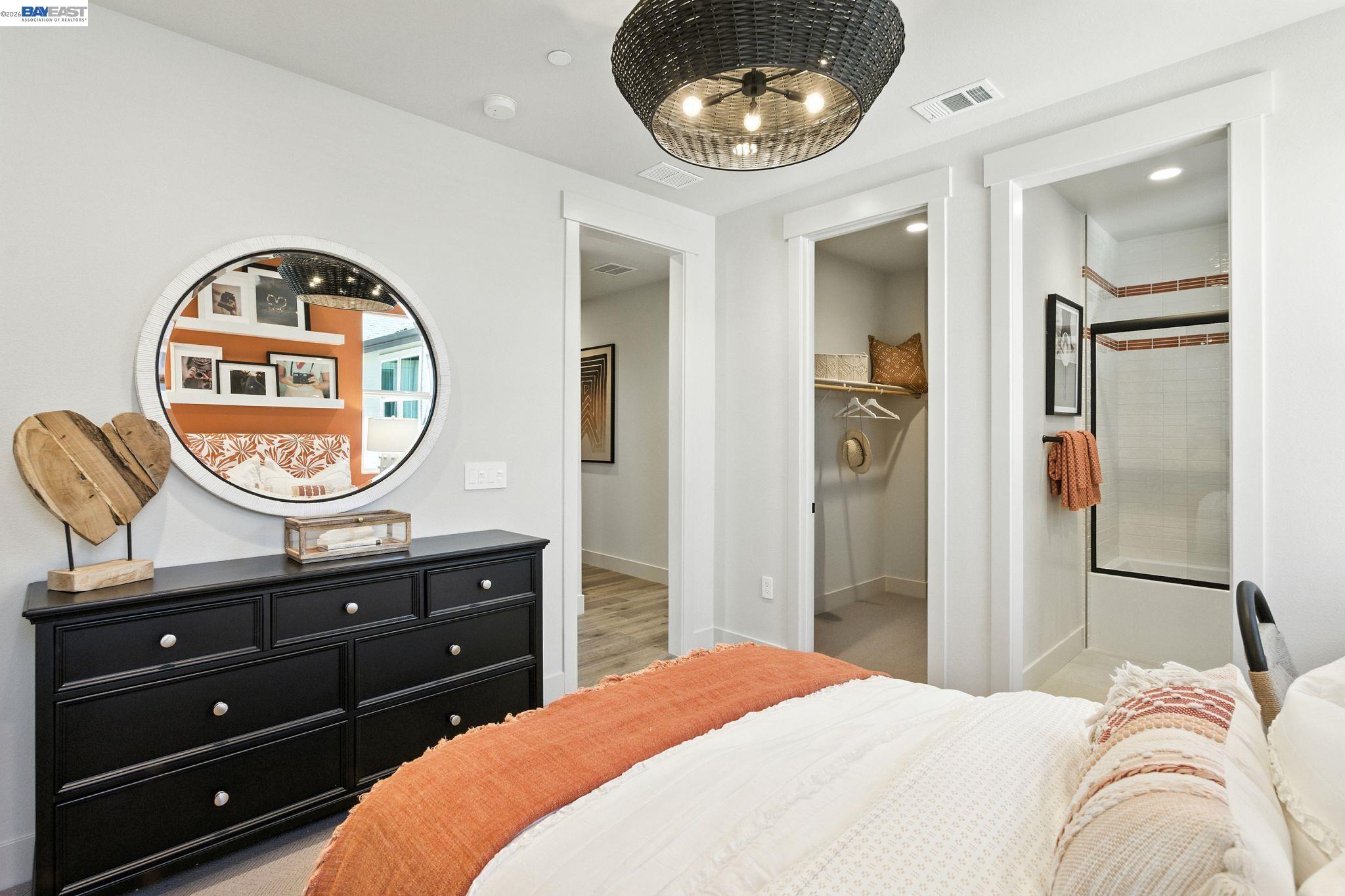 4237 Langley Road Dublin, CA 94568 - Photo 28 of 40 a bedroom with a bed and a mirror on dresser