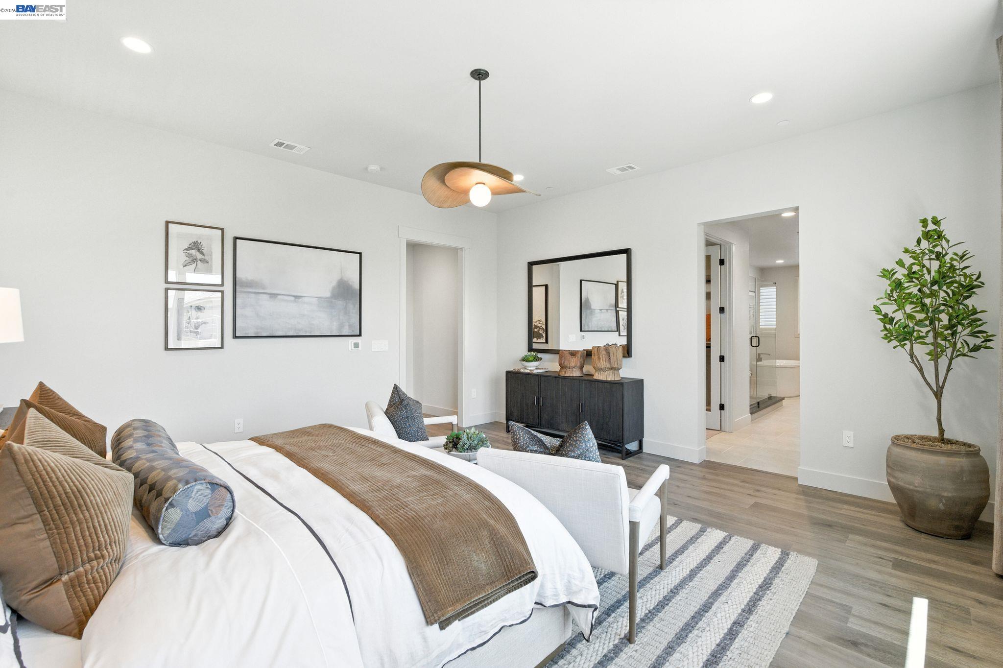 4237 Langley Road Dublin, CA 94568 - Photo 31 of 40 a bedroom with a bed and a chandelier