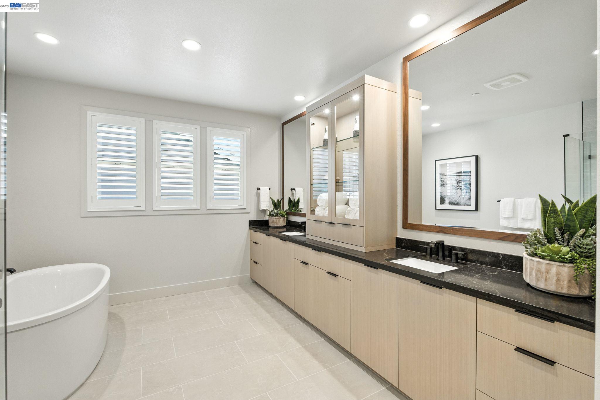 4237 Langley Road Dublin, CA 94568 - Photo 32 of 40 a large white kitchen with a large window and sink