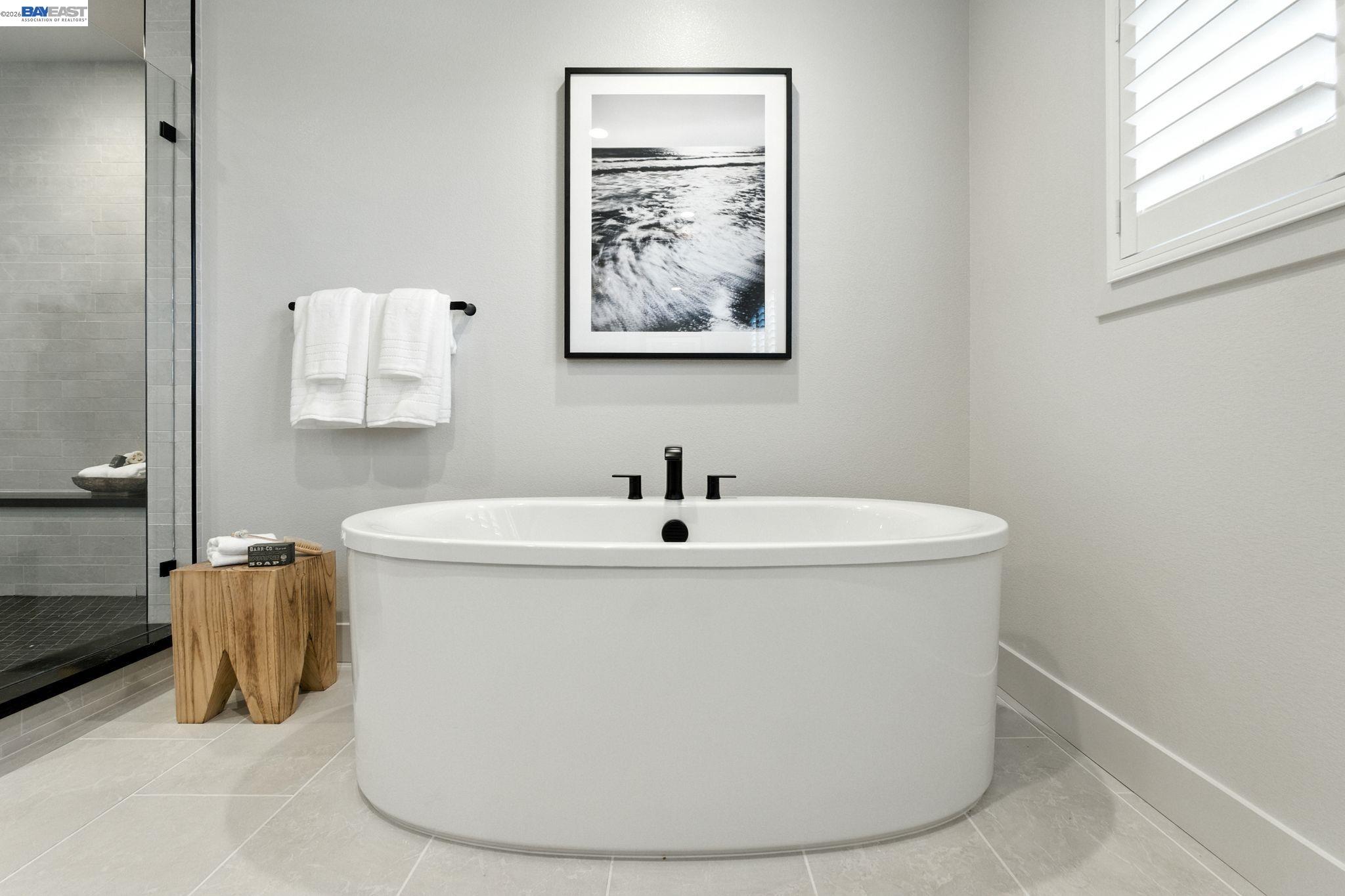 4237 Langley Road Dublin, CA 94568 - Photo 33 of 40 a white bath tub sitting in a bathroom