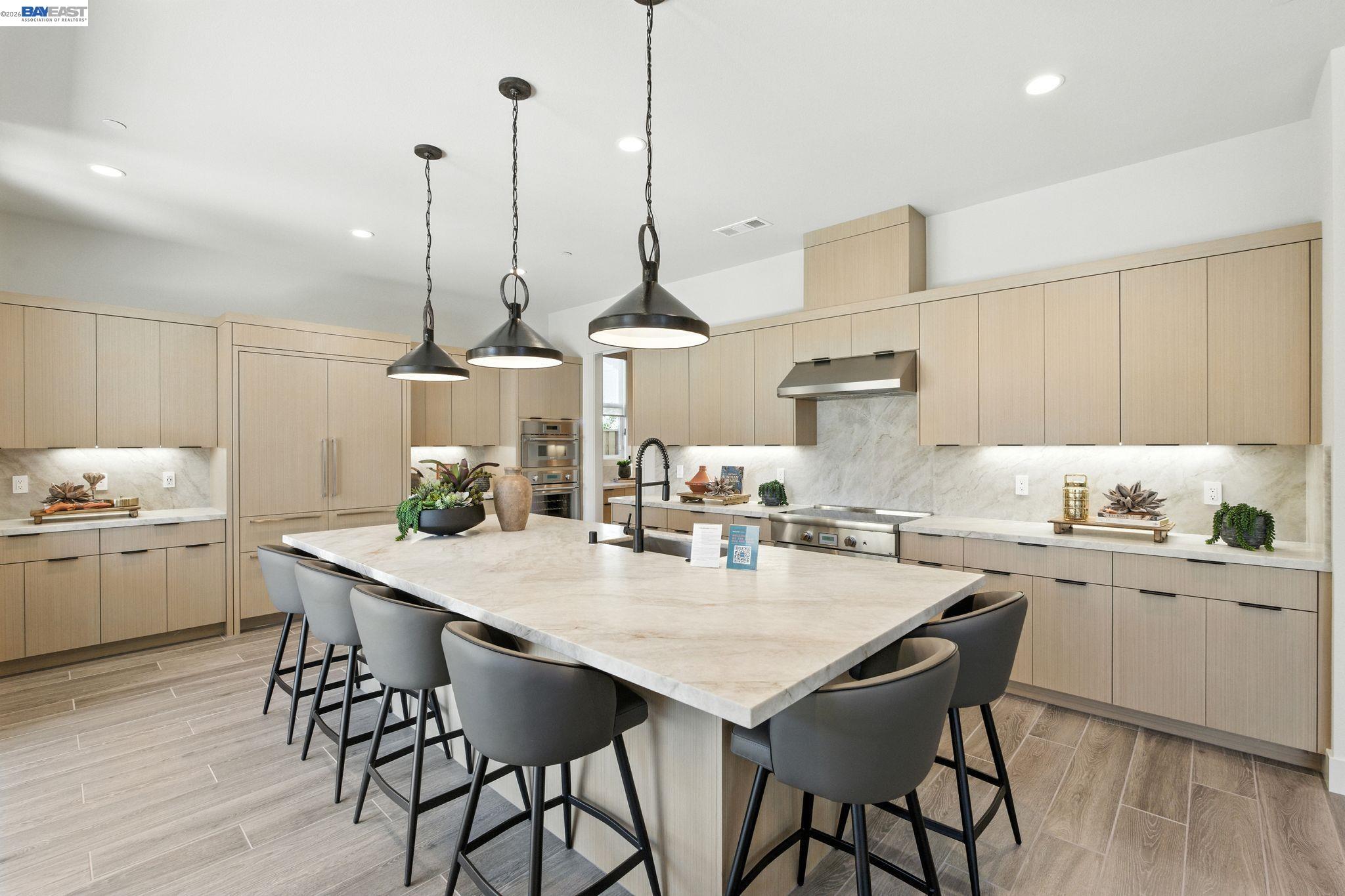 4237 Langley Road Dublin, CA 94568 - Photo 4 of 40 a kitchen with a table chairs sink and cabinets
