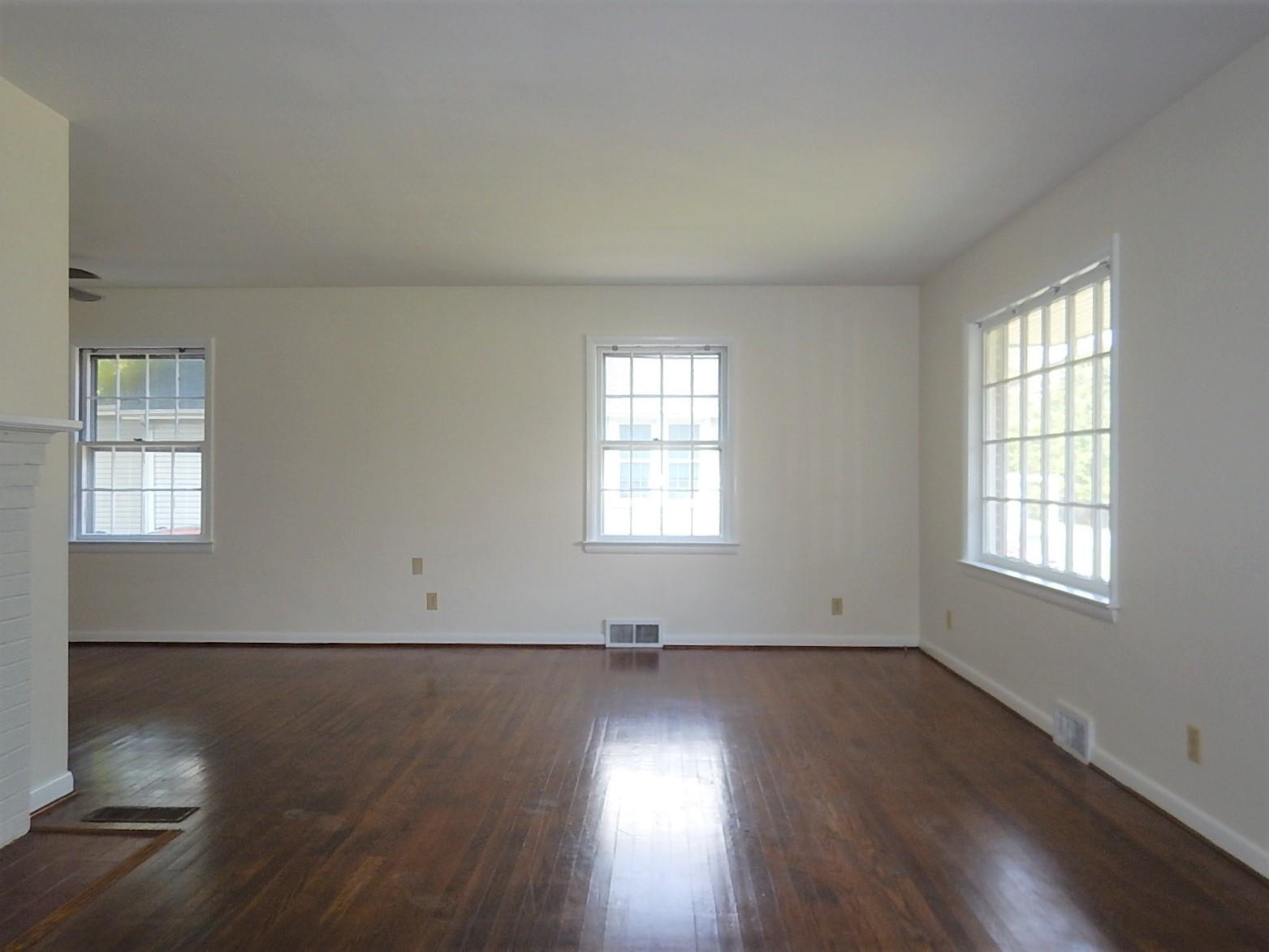 1842 Lyndhurst Road Waynesboro, VA 22980 - Photo 3 of 16 an empty room with wooden floor and windows