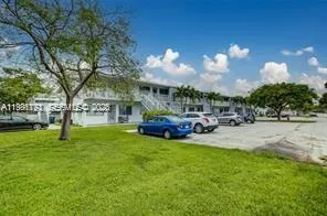 a view of a house with a back yard